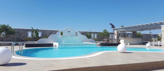 Dive in the beautiful pool of Orabel Suites in Santorini